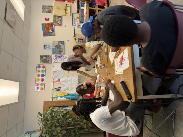 Participants collaborating on a group art project