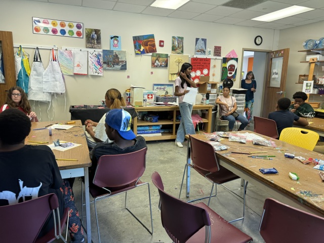 Facilitator presenting to students during a wellness workshop